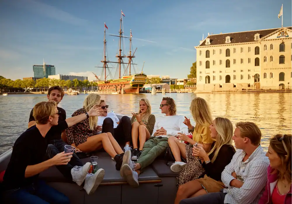 Group of people on a sloop in Amsterdam