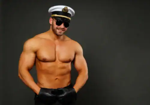 Magic Mike boat Amsterdam man with skipper hat on