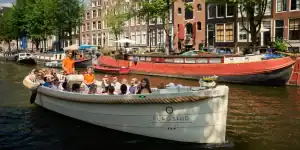 An open boat with people in Amsterdam