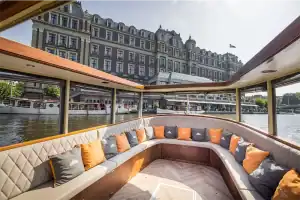 The Titanic saloon boat, with a view of the Amstel Hotel from the aft deck