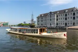 Side view saloon boat Wolk in front of Maritime Museum