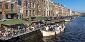 Luxury sloop in Haarlem next to a restaurant