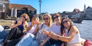A boat tour of Haarlem with a drink in hand