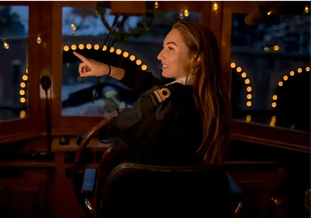 Skipper in a salon boat in the evening